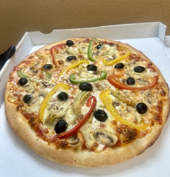 Pizza 4 saisons du restaurant Au Pouce Gourmand